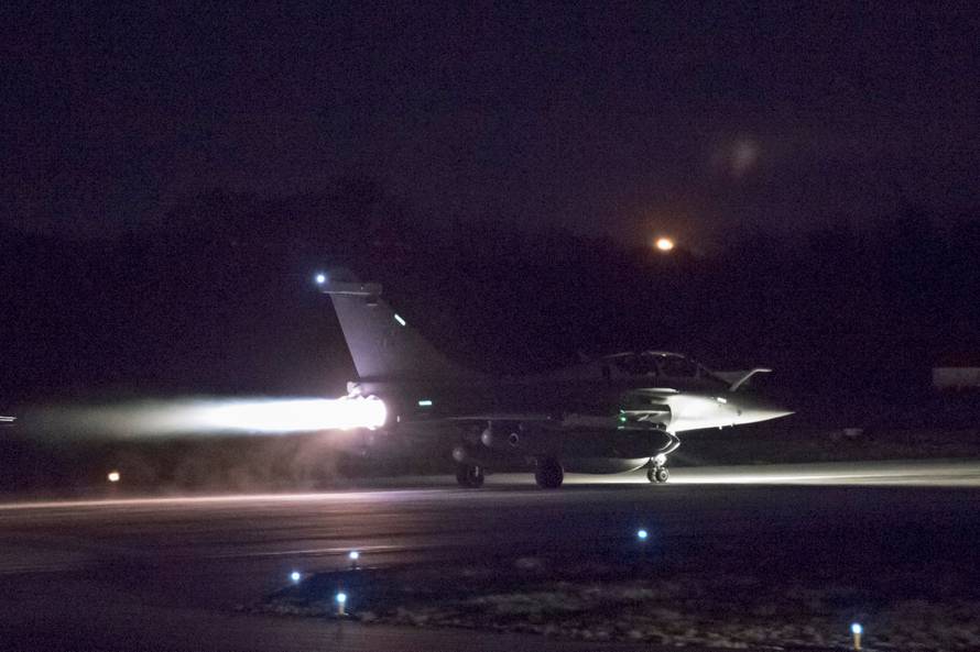 A plane preparing to take off as part of the joint airstrike operation by the British, French and U.S. militaries in Syria, is seen in this picture obtained via social media