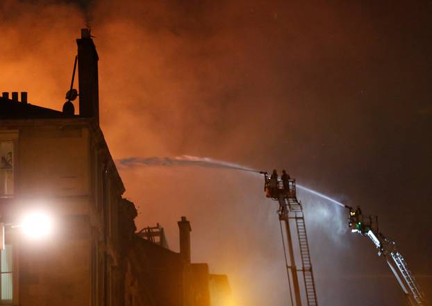 Firefighters attend to a blaze at the Mackintosh Building at the Glasgow School of Art, which is the second time in four years, Glasgow, Scotland, Britain