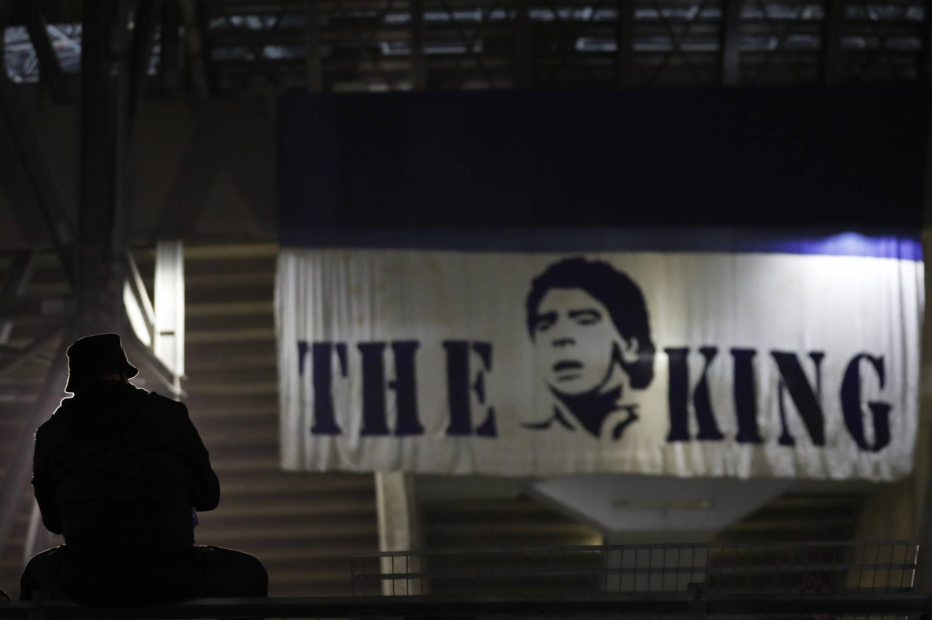 People mourn the death of Argentine soccer legend Diego Maradona, in Naples