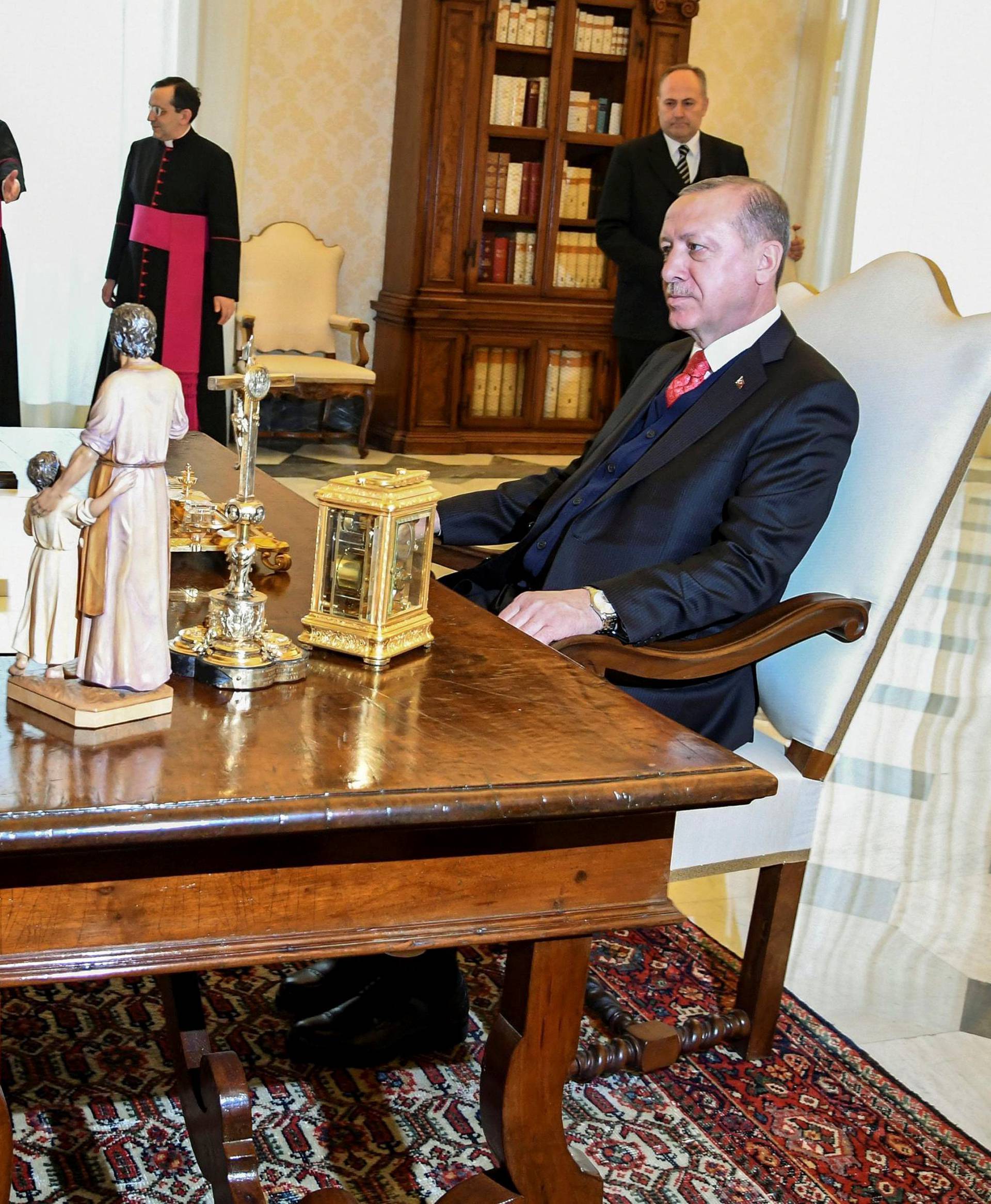 Pope Francis talks with Turkish President Tayyip Erdogan during a private audience at the Vatican