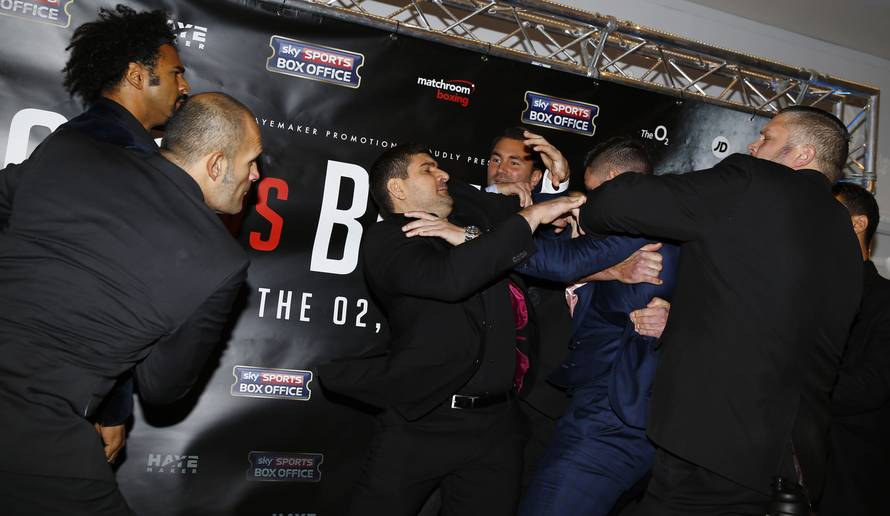 David Haye and Tony Bellew clash after the press conference as promoter Eddie Hearn looks on