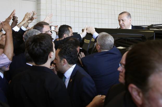 Turkish President Tayyip Erdogan departs after the jenazah Islamic funeral prayer for the late boxing champion Muhammad Ali in Louisville