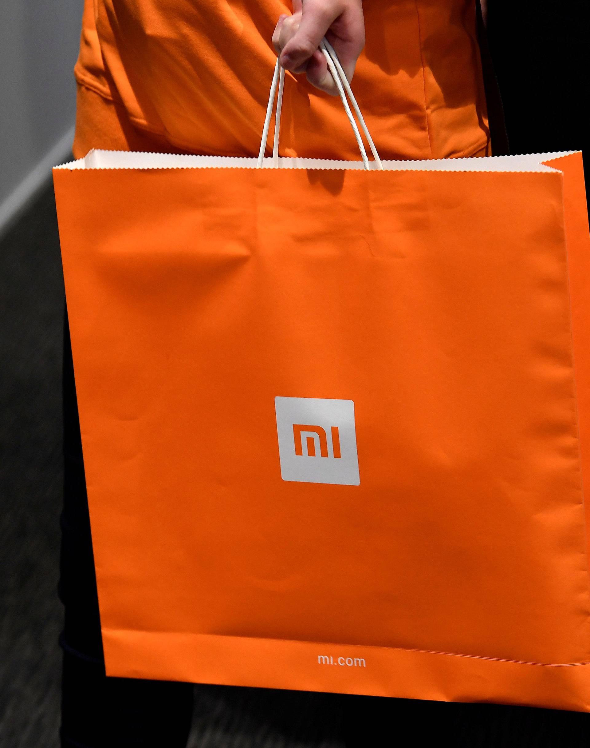 Xiaomi branding is seen on a carrier bag at a UK launch event in London