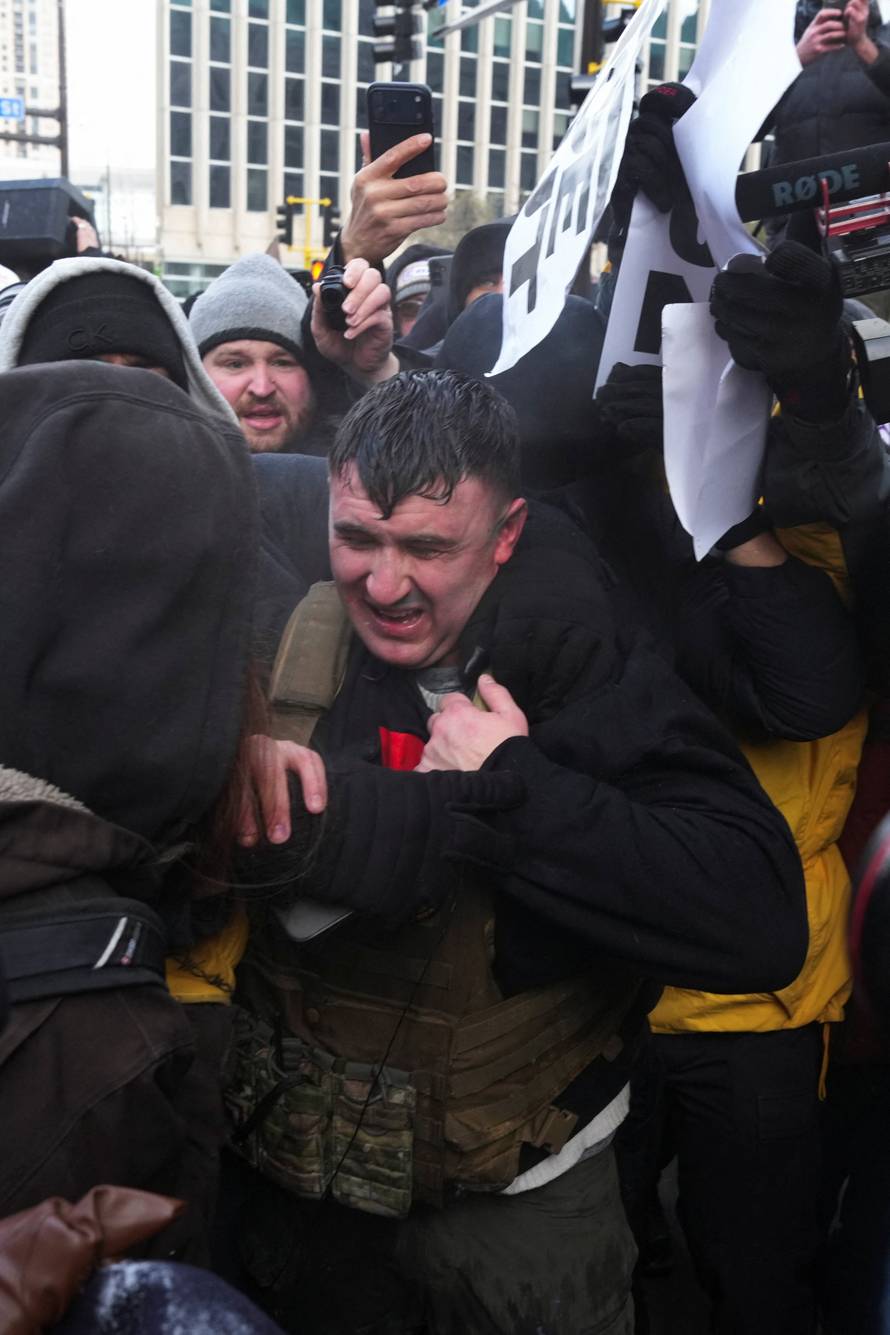 People attend the "March Against Minnesota Fraud" in Minneapolis