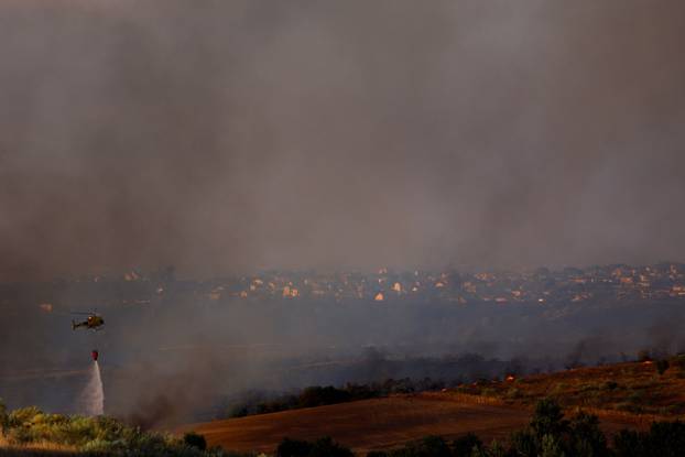 A wildfire burns on the outskirts of Valmojado