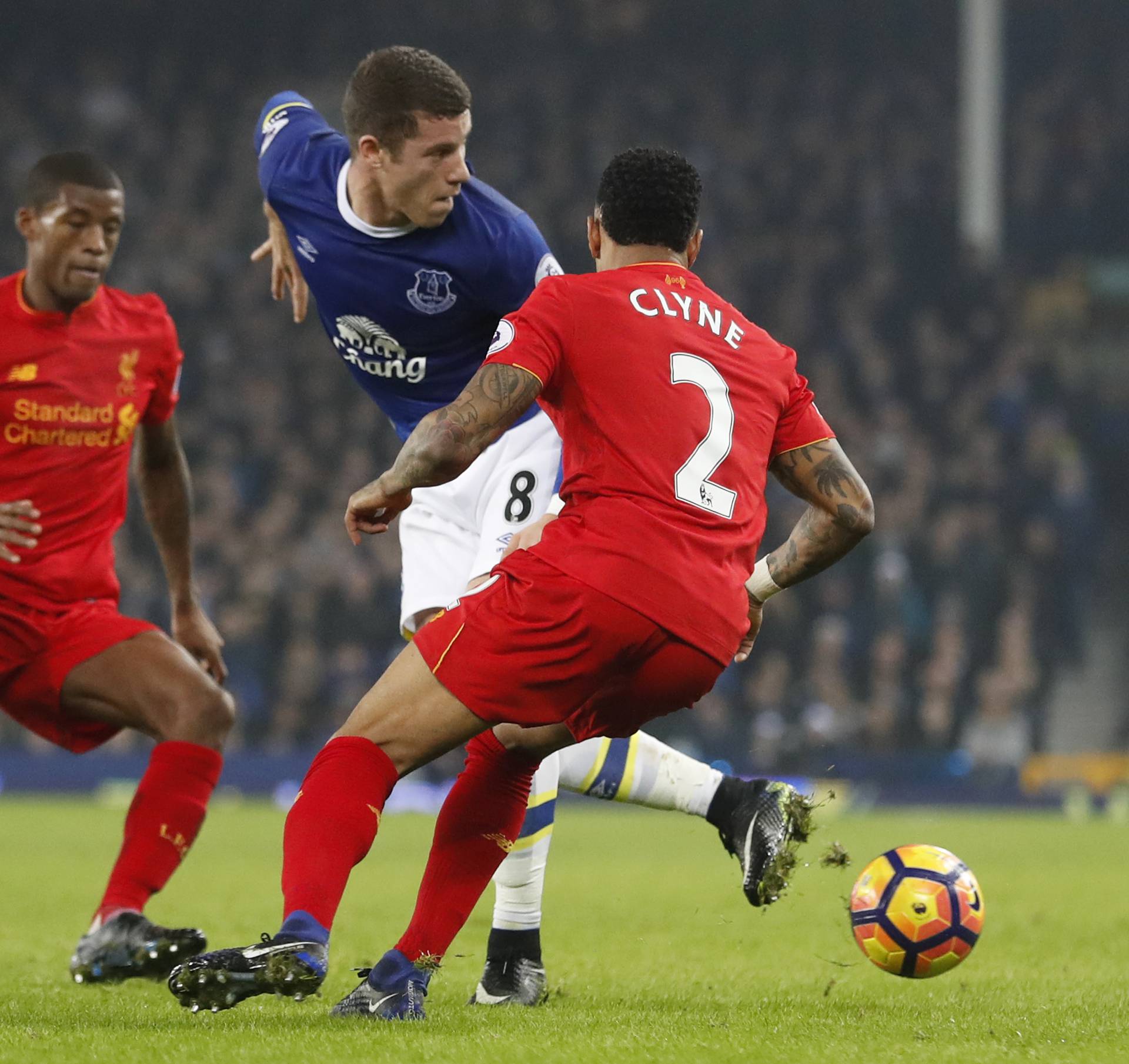 Everton's Ross Barkley in action with Liverpool's Nathaniel Clyne and Georginio Wijnaldum