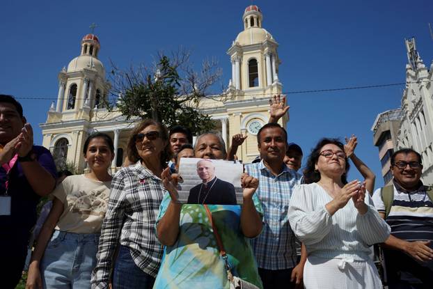 People gather in front of the Cathedral of Saint Mary in Chiclayo