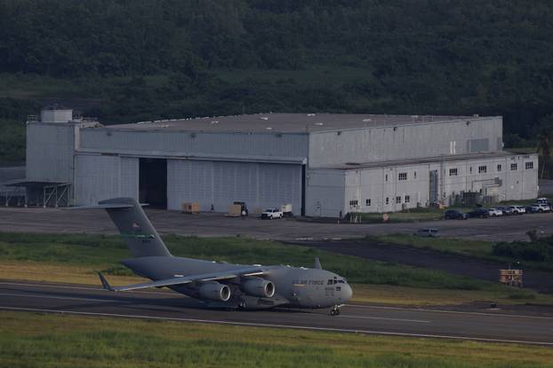 A U.S. Air Force C-17 Globemaster III taxis on the runway in front of a hangar formerly known as Building 200 at the former Roosevelt Roads Naval Station in Ceiba.