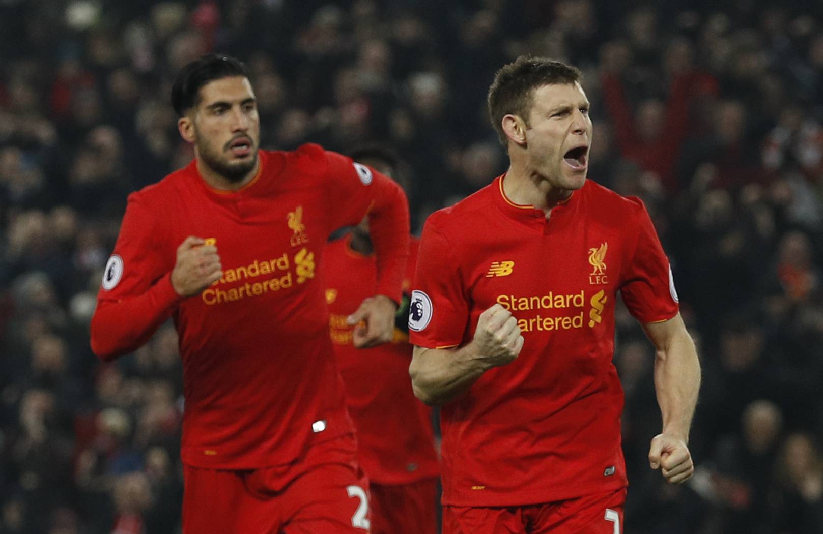 Liverpool's James Milner celebrates scoring their second goal with team mates