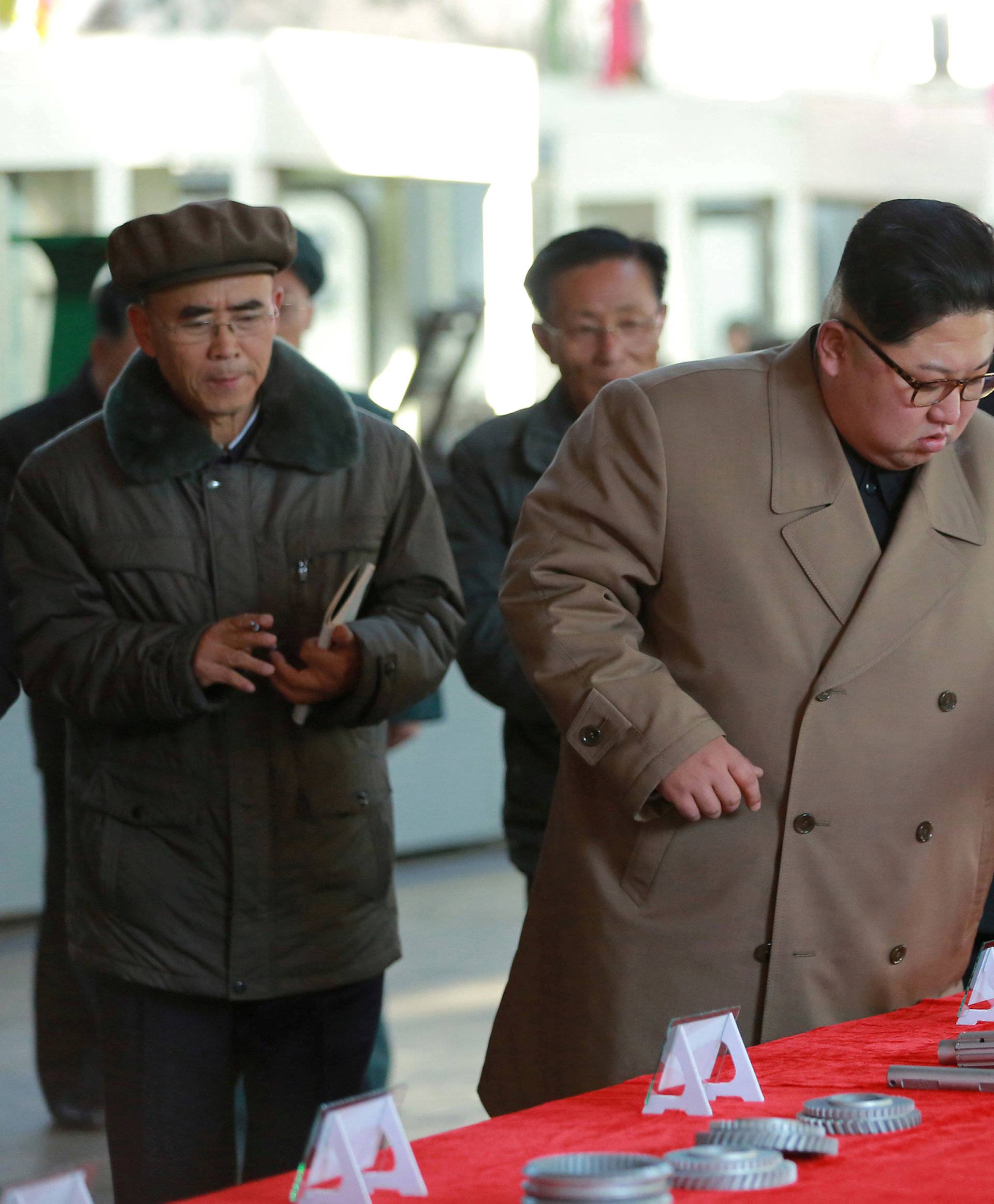 FILE PHOTO: North Korean leader Kim Jong Un gives field guidance to the Kumsong Tractor Factory in this undated picture provided by KCNA