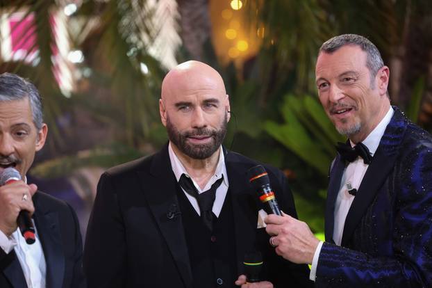 ActorJohn Travolta dances with Amadeus and Fiorello at the Sanremo Festival