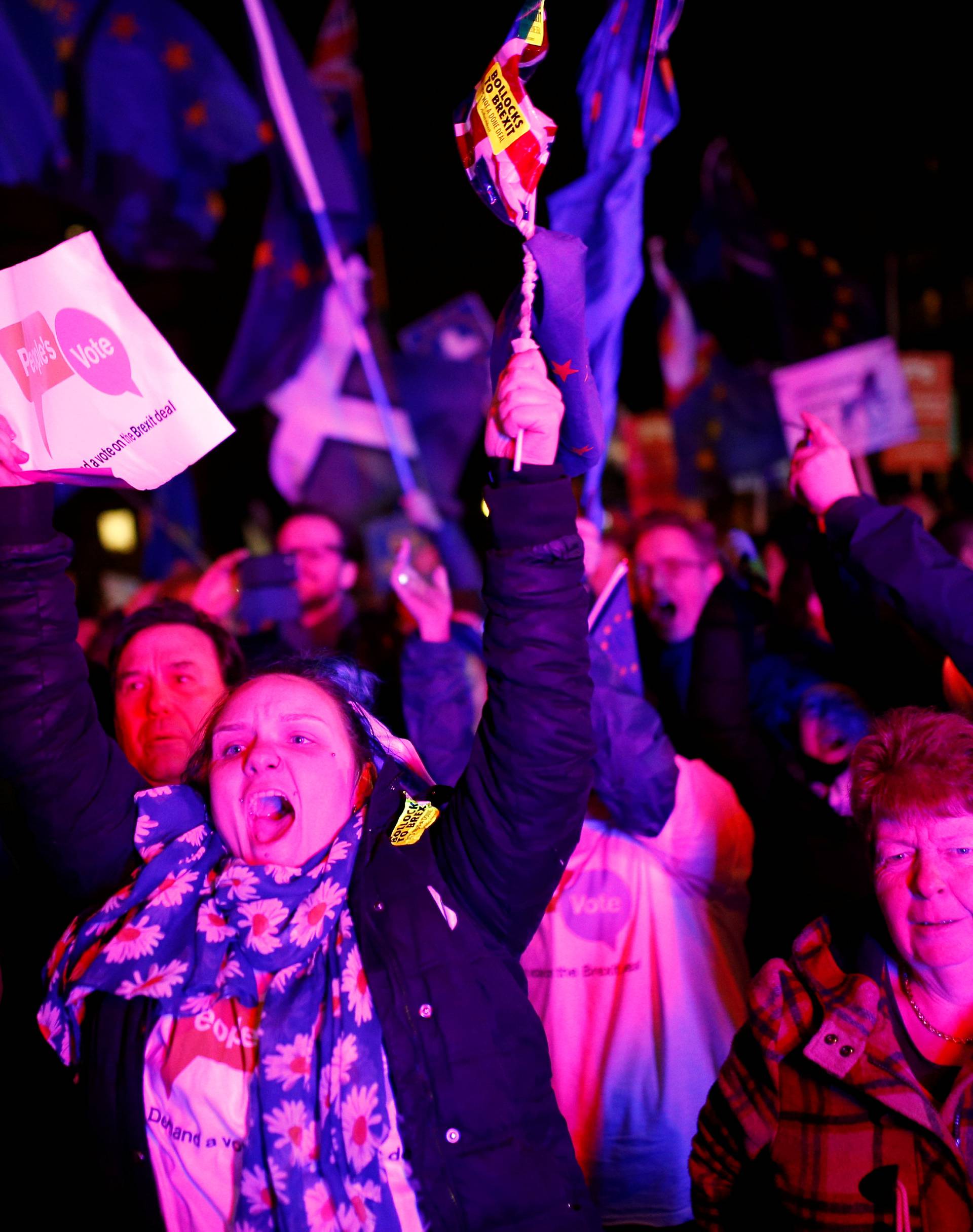 Protesters react after the result was announced on Prime Minister Theresa May's Brexit deal in London