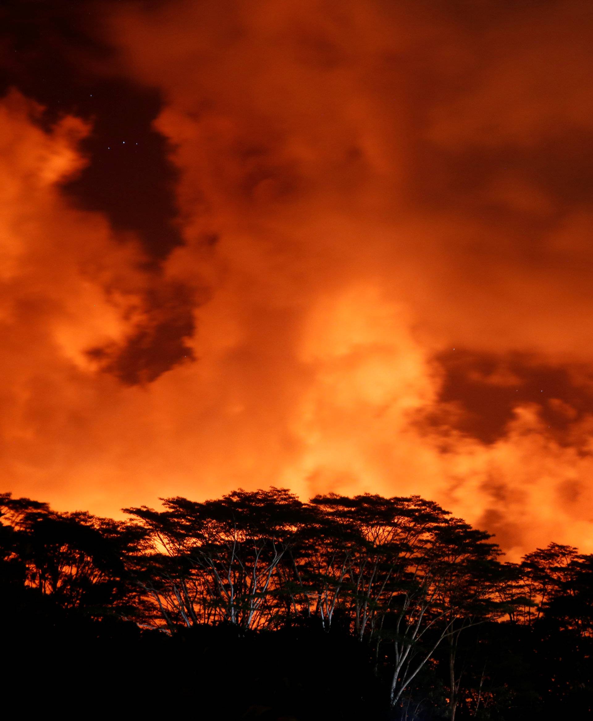Clouds glow above a lava flow on the outskirts of Pahoa