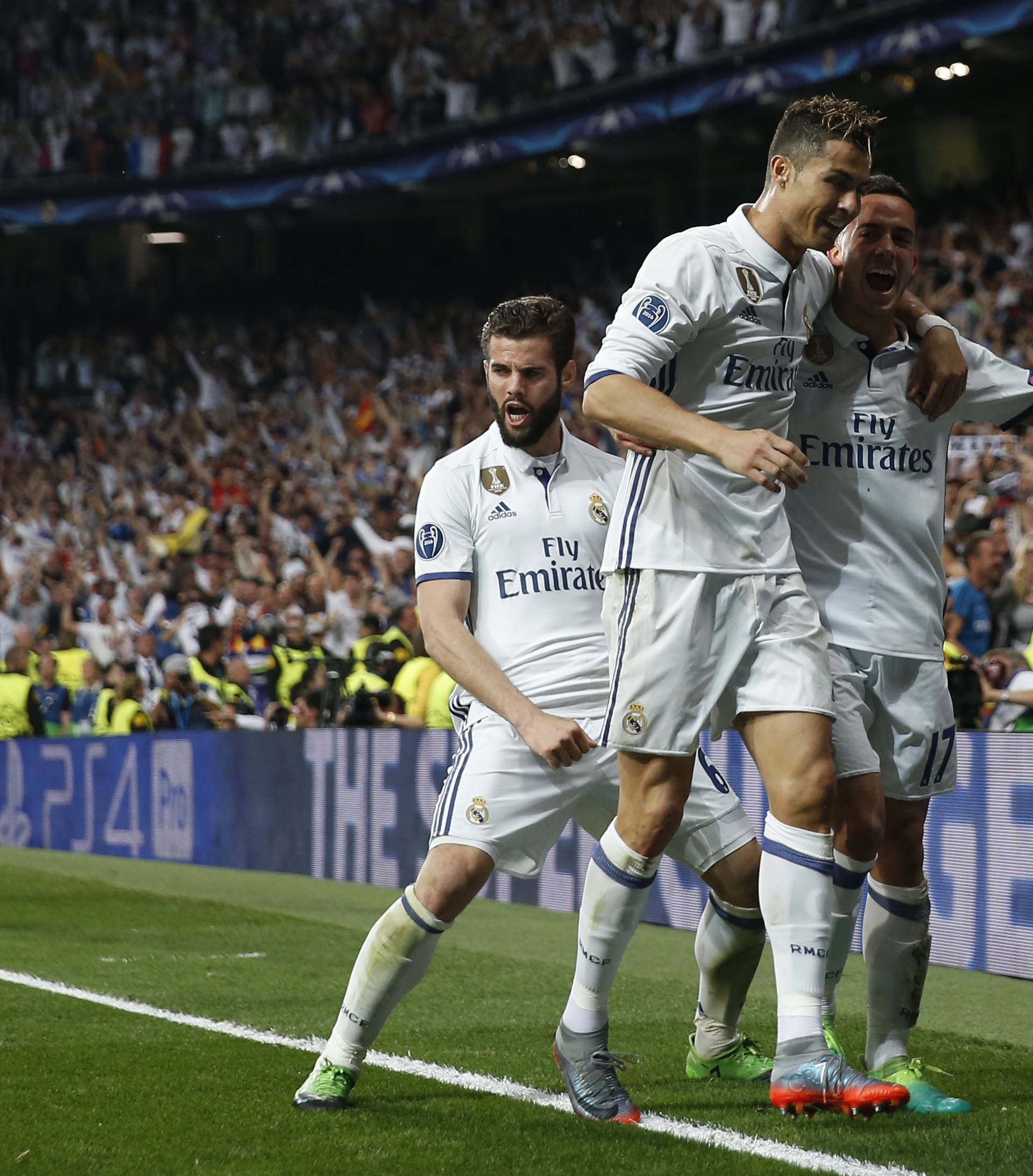 Real Madrid's Cristiano Ronaldo celebrates scoring their third goal with team mates
