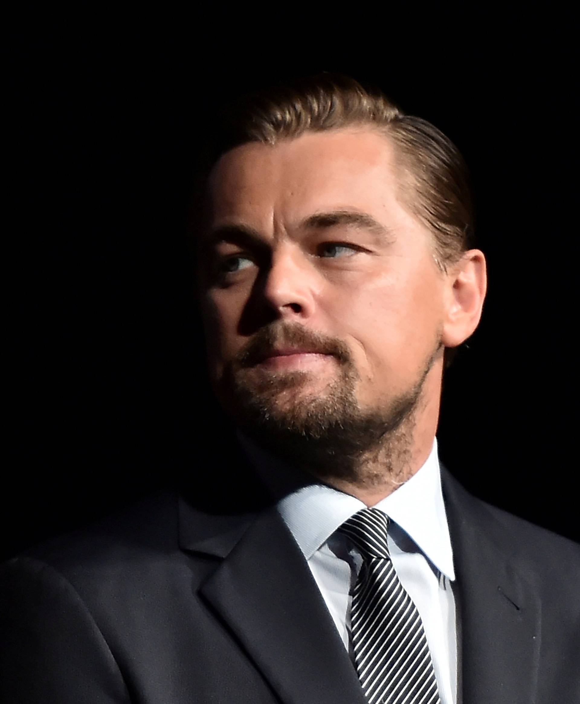 FILE PHOTO: US actor Leonardo DiCaprio looks on prior to speaking on stage during the Paris premiere of the documentary film "Before the Flood" in Paris