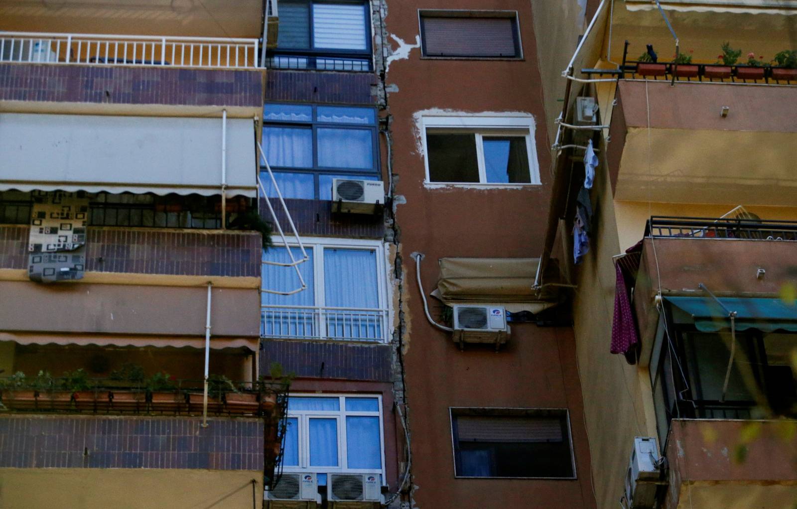 A crack on the building's facade is seen after it was damaged by an earthquake in Tirana