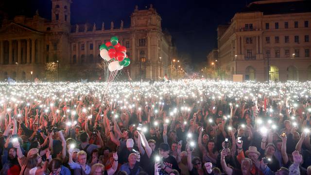 People attend a protest against the government of Prime Minister Viktor Orban in Budapest