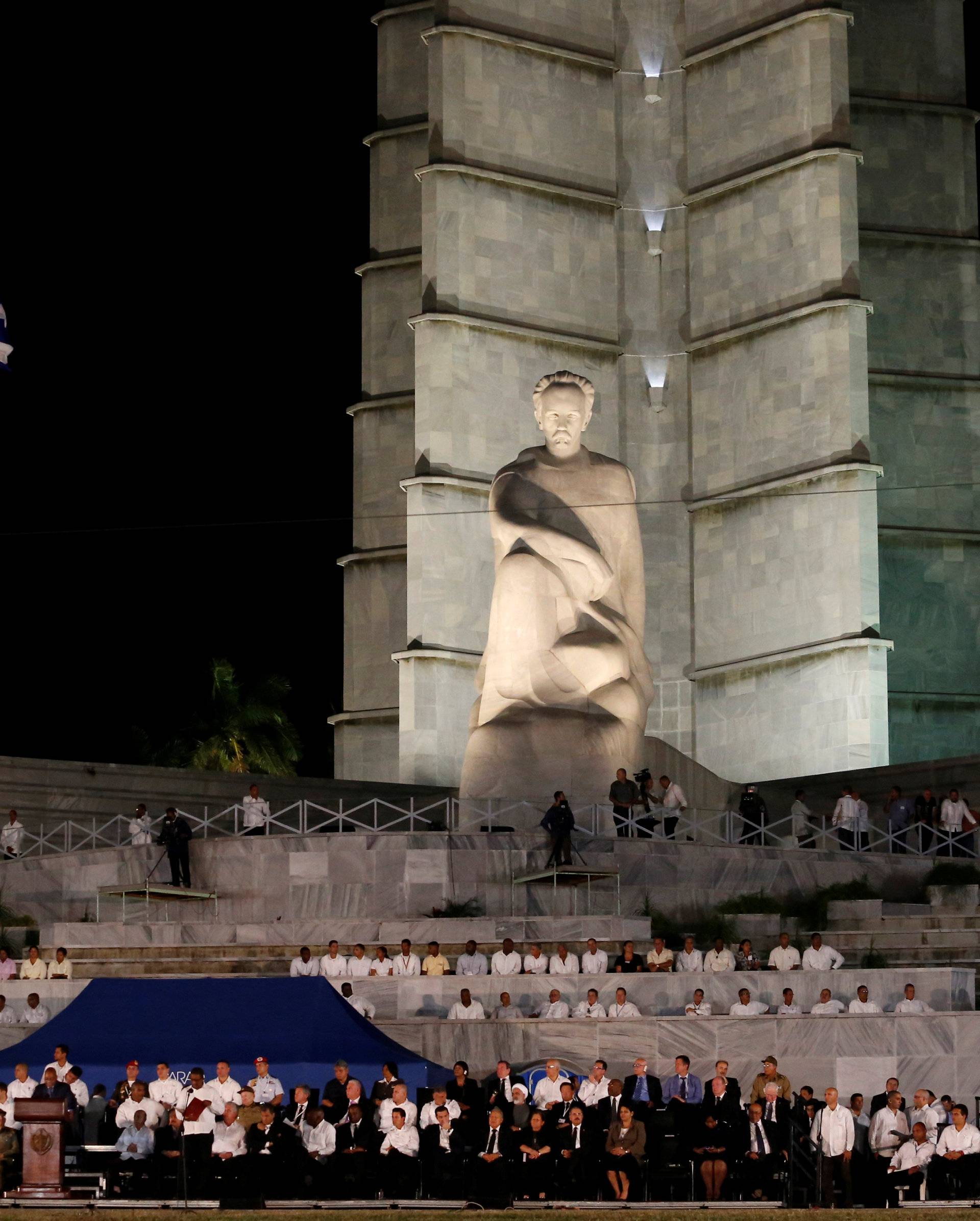The Cuban flag flies at half-mast as dignitaries gather for a massive tribute to Cuba's late President Fidel Castro in Revolution Square in Havana
