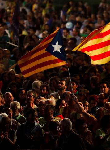 People attend a closing rally in favour of the banned October 1 independence referendum in Barcelona
