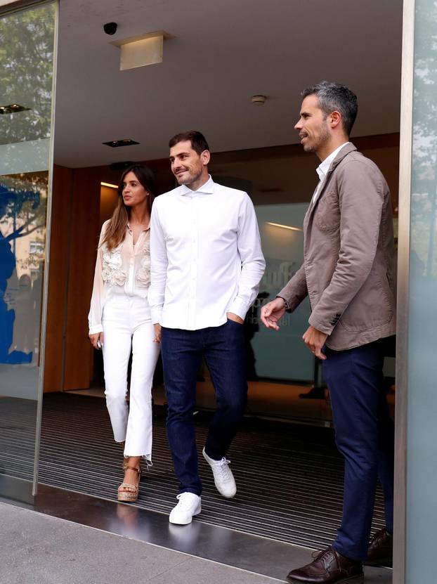 Spanish soccer player Iker Casillas leaves CUF Porto hospital accompanied by his wife Sara Carbonero in Porto