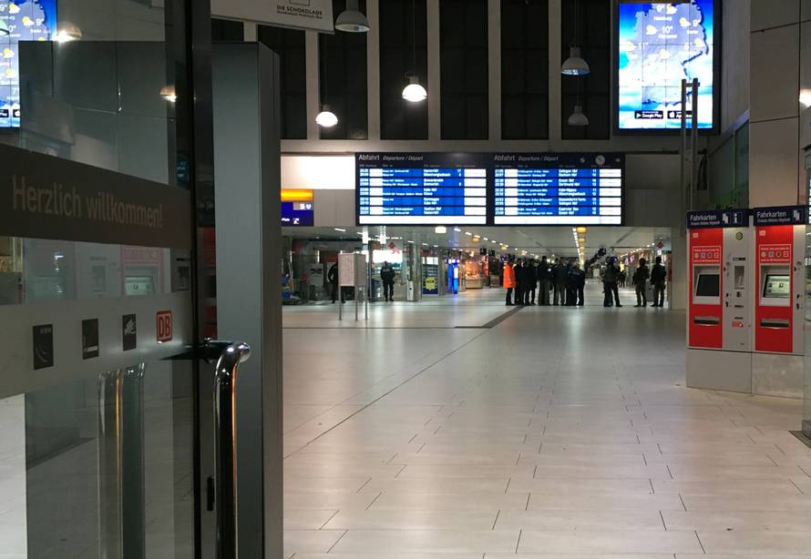 Staff members are pictured inside Dusseldorf train station