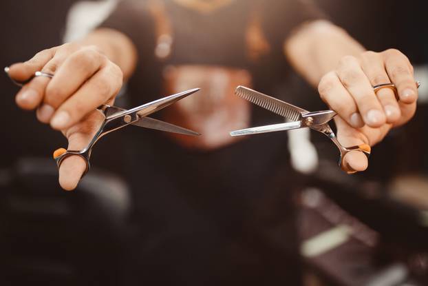 Barbershop,Close-up,Of,Barber,Holds,Clip-on,Hair,Clipper