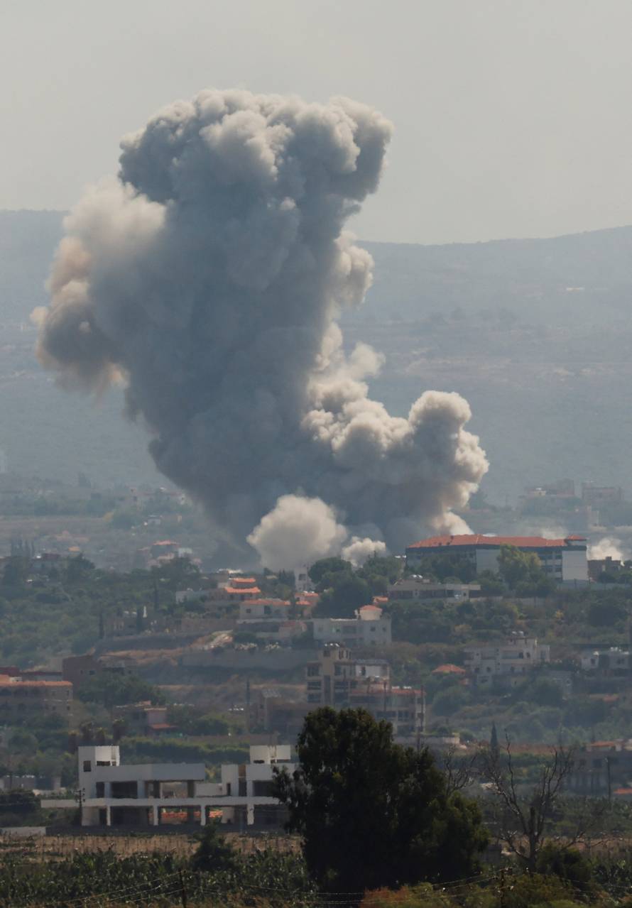 Smoke billows over southern Lebanon following Israeli strikes, as seen from Tyre, southern Lebanon