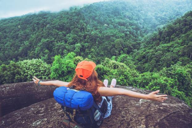 Asian women travel relax in the holiday. Standing on the mountai