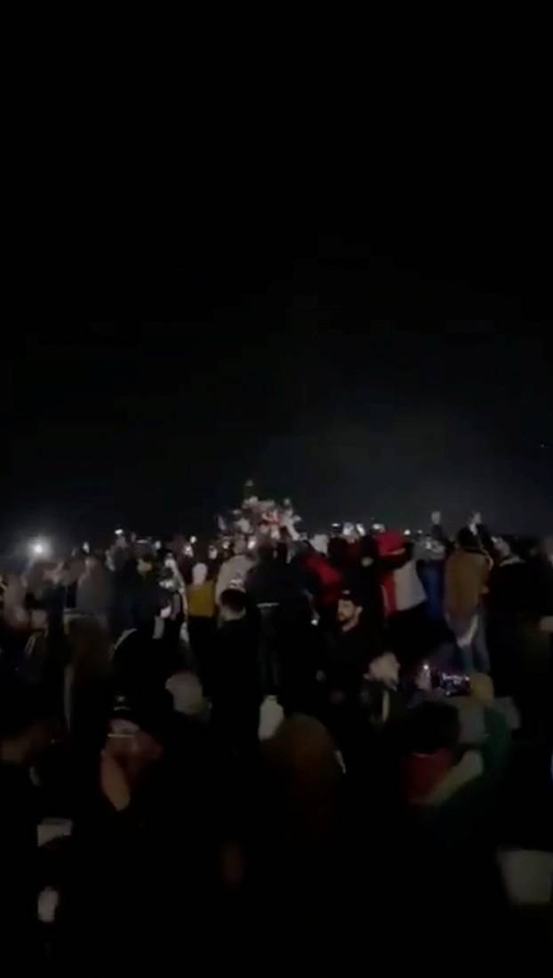 Statue of former President of Syria Hafez al-Assad is toppled in Homs