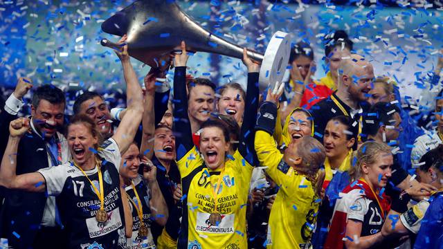 Players of the CSM Bucuresti celebrate with the trophy after they won the EHF Women's Champions League Final 4 handball in Budapest