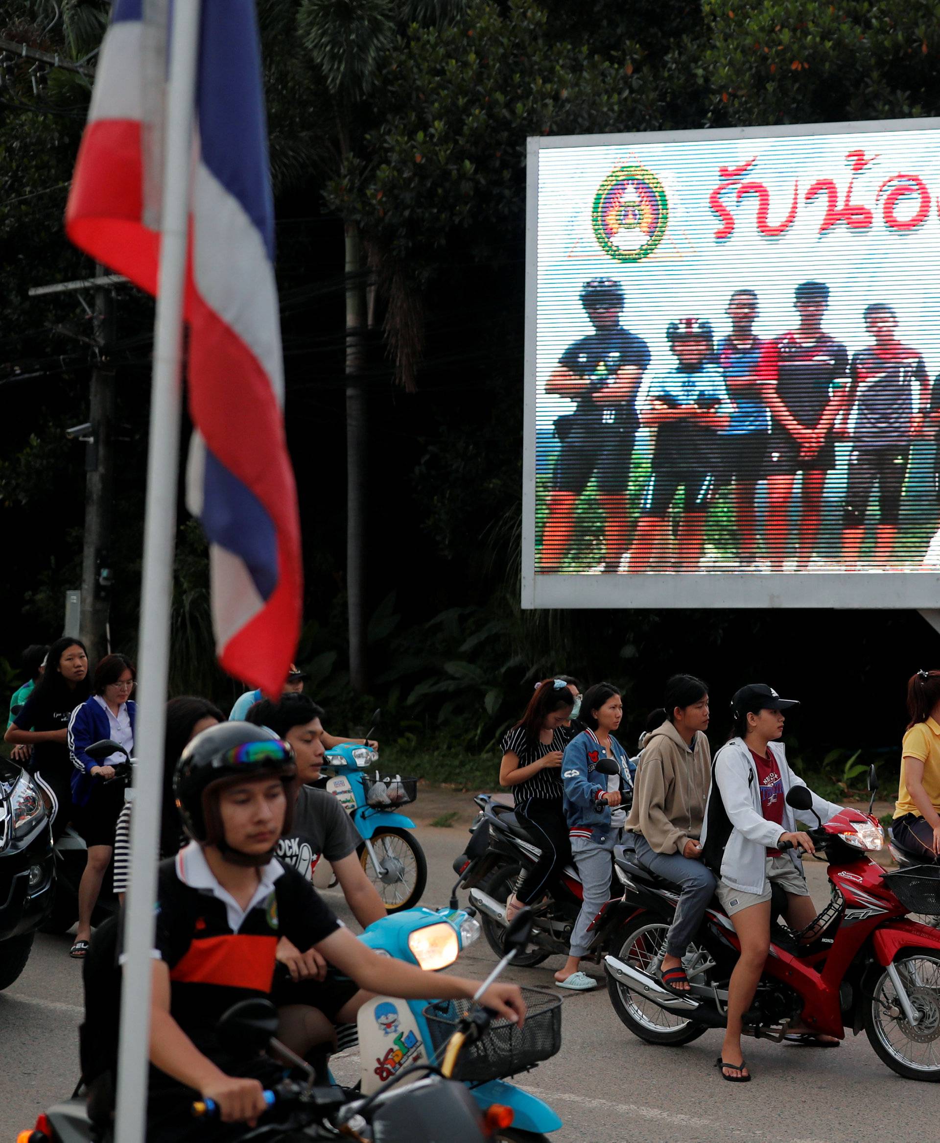 A board showing "Welcome home, boys", is seen after rescue effort has begun for the 12 schoolboys and their soccer coach trapped in Tham Luang cave, in Chiang Rai