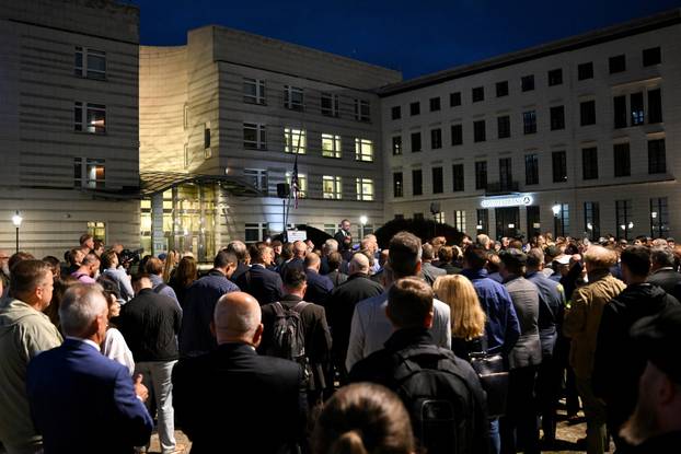 People gather to commemorate of Charlie Kirk in front of the Embassy of the United States in Berlin