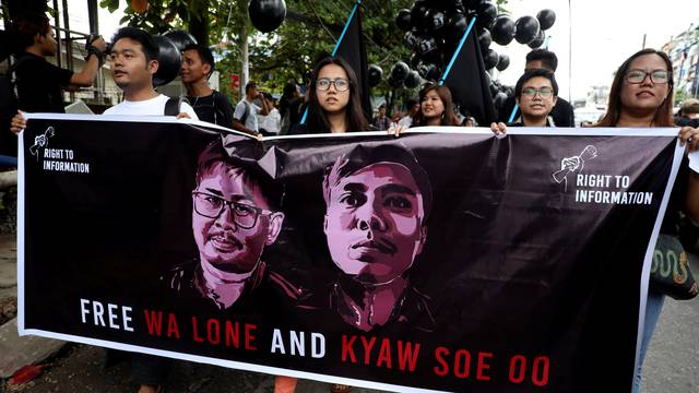 People march to show solidarity for jailed Reuters journalists Wa Lone and Kyaw Soe Oo in Yangon