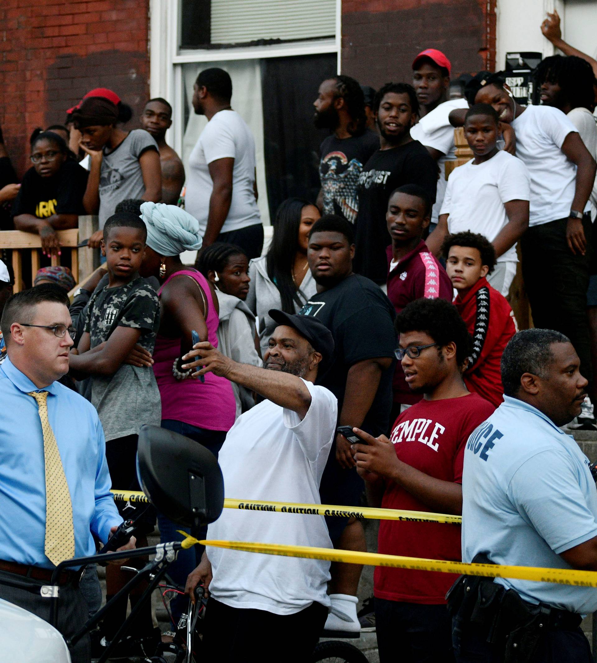 People gather during an active shooter situation in Philadelphia