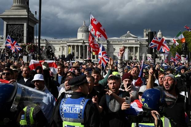 Anti-racism protesters gather to counter anti-immigration rally led by Tommy Robinson, in London