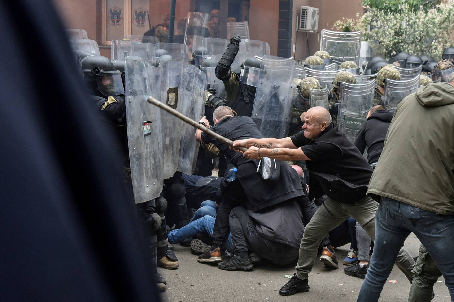 NATO Kosovo Force (KFOR) soldiers clash with local Kosovo Serb protesters in the town of Zvecan