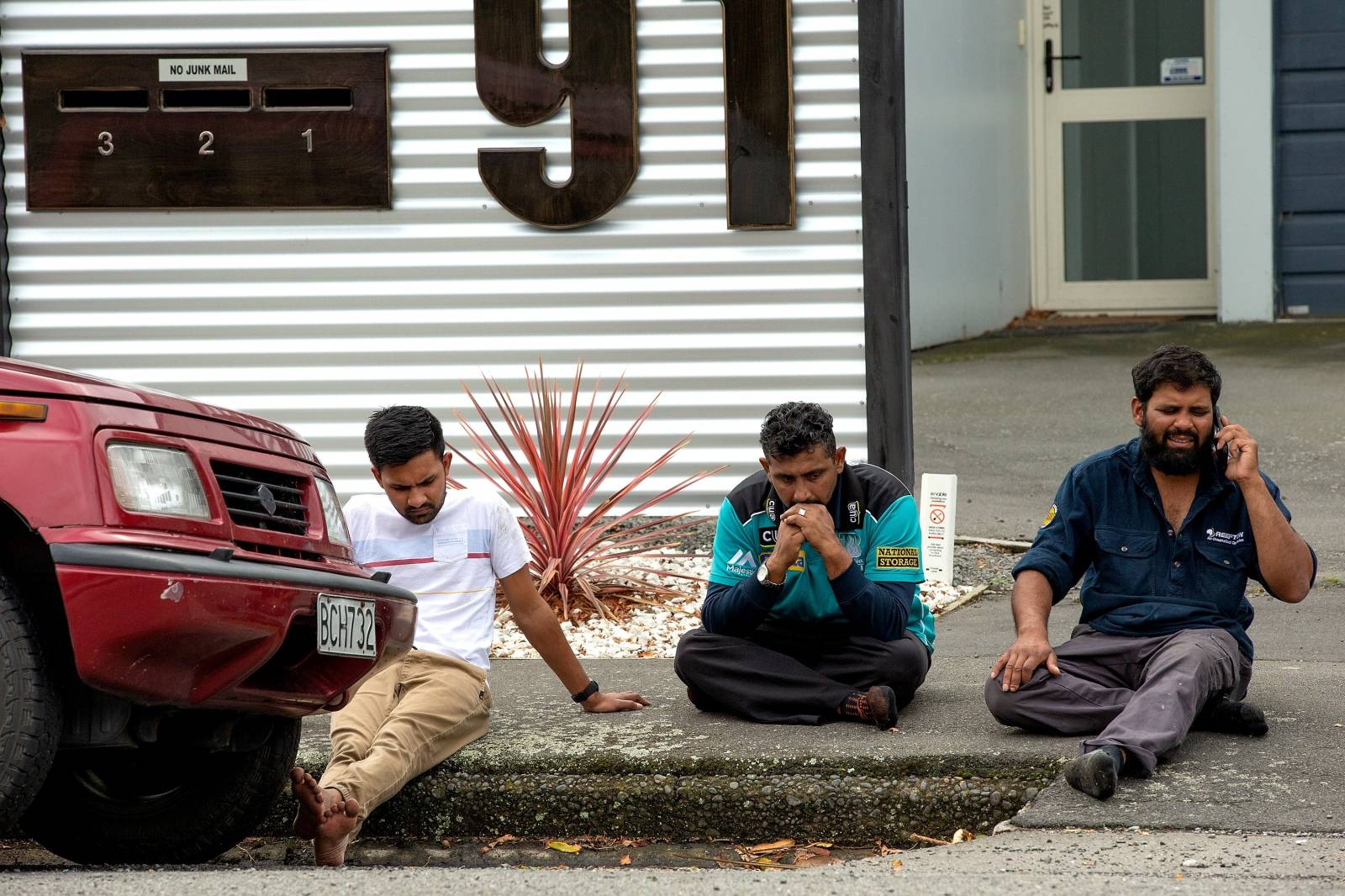 Grieving members of the public following a shooting at the Al Noor mosque in Christchurch