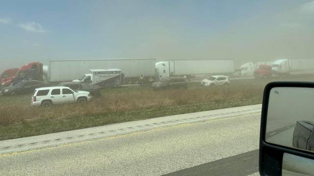 A view of vehicles in a dust storm