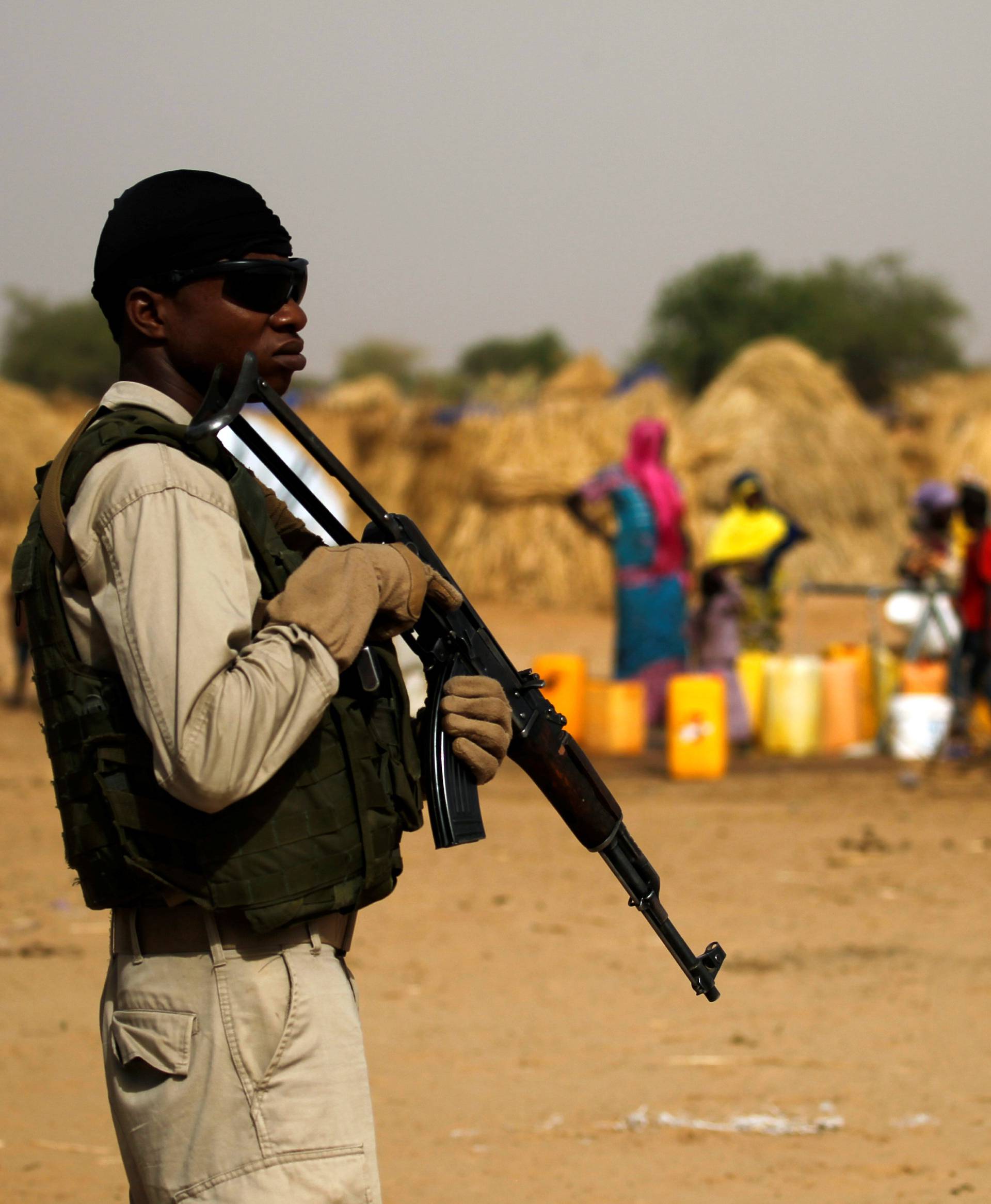 A Nigerien soldier stands guard in a camp of the city of Diffa during the visit of Niger's Interior Minister Mohamed Bazoum following attacks by Boko Haram fighters in the region of Diffa