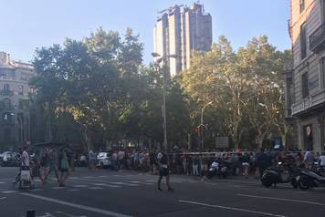 People pictured on Las Ramblas after a van crashed into crowds in Barcelona