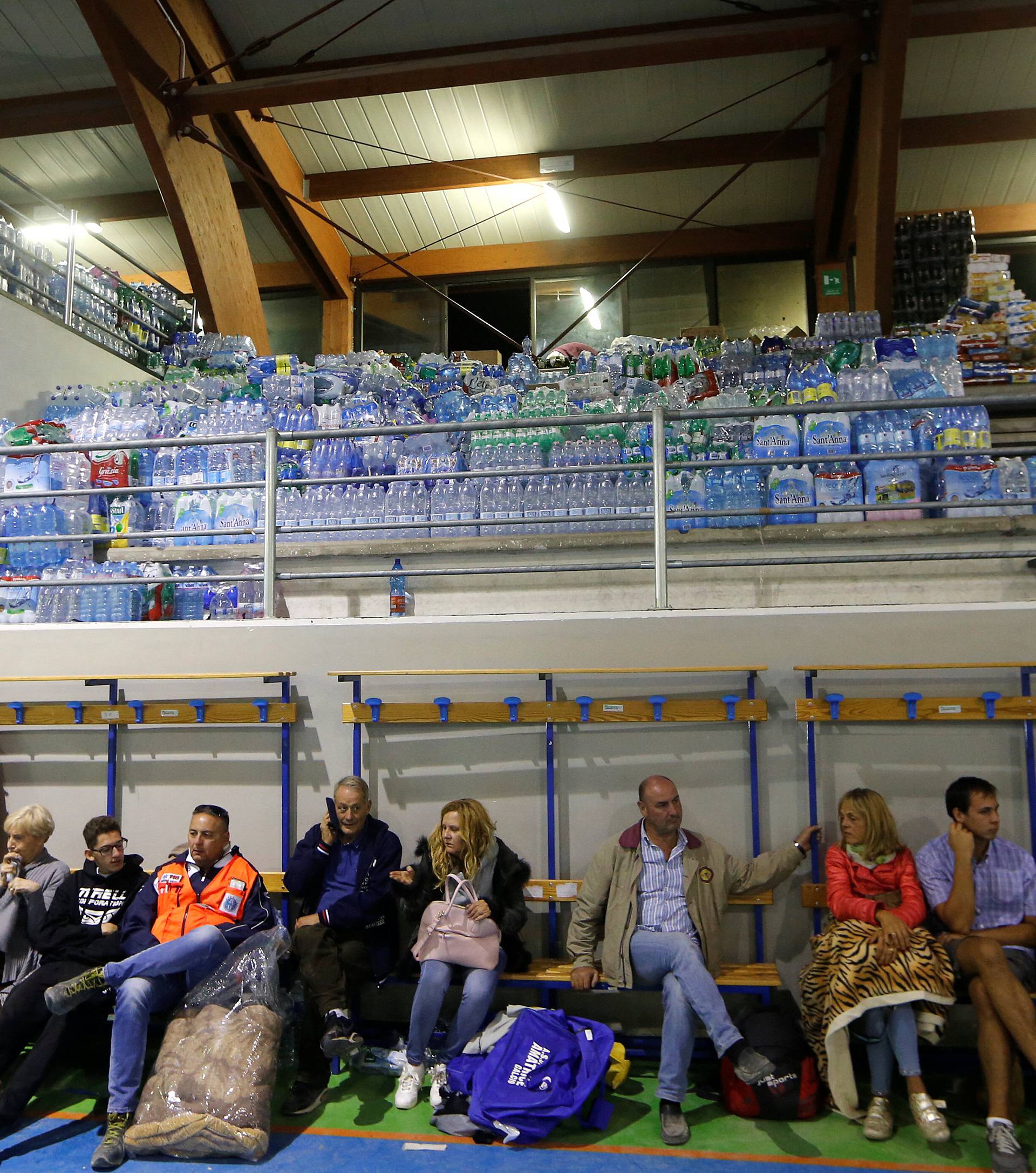 People rest following an earthquake in Amatrice