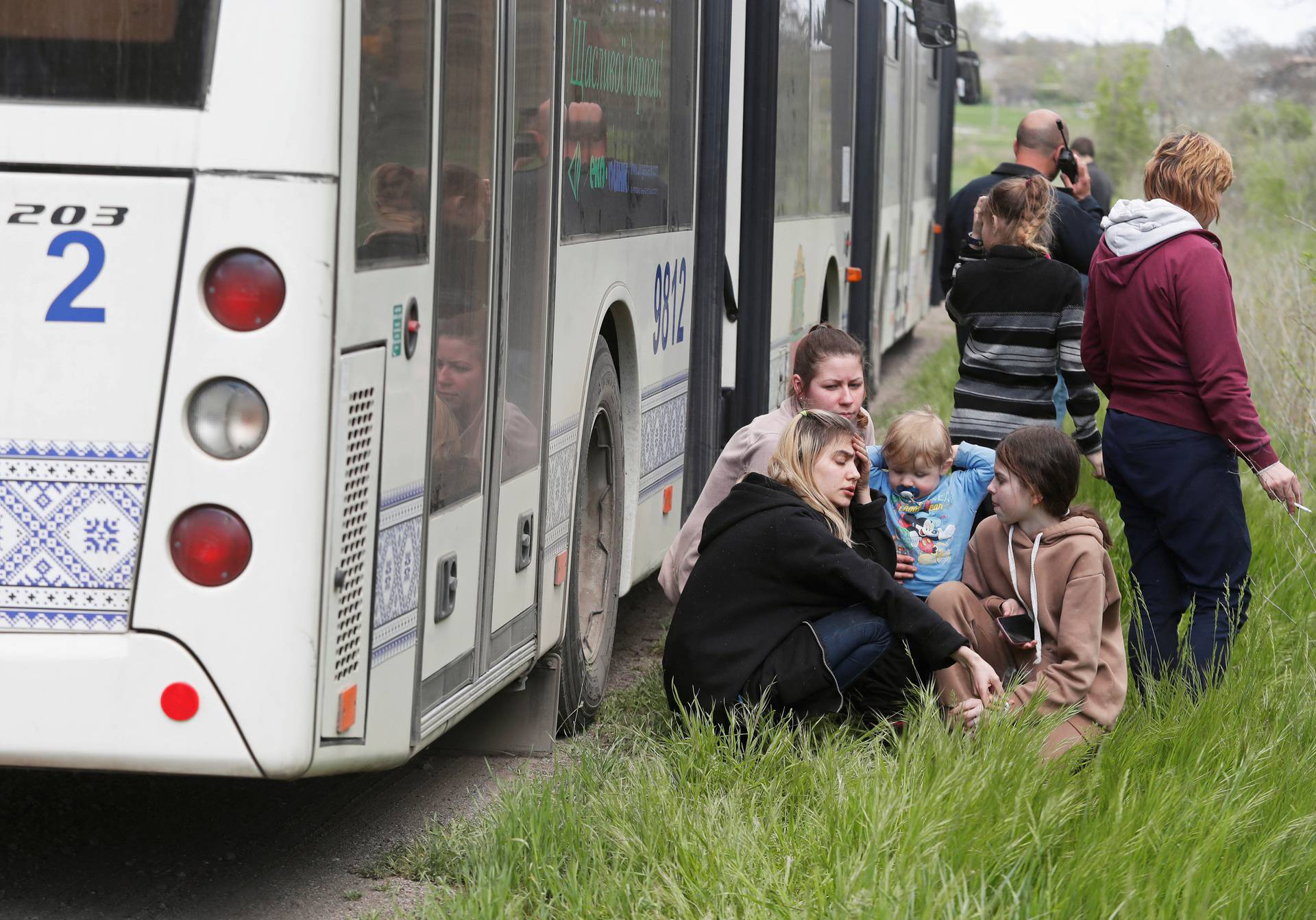 Evacuees from Mariupol travel in a convoy to Zaporizhzhia