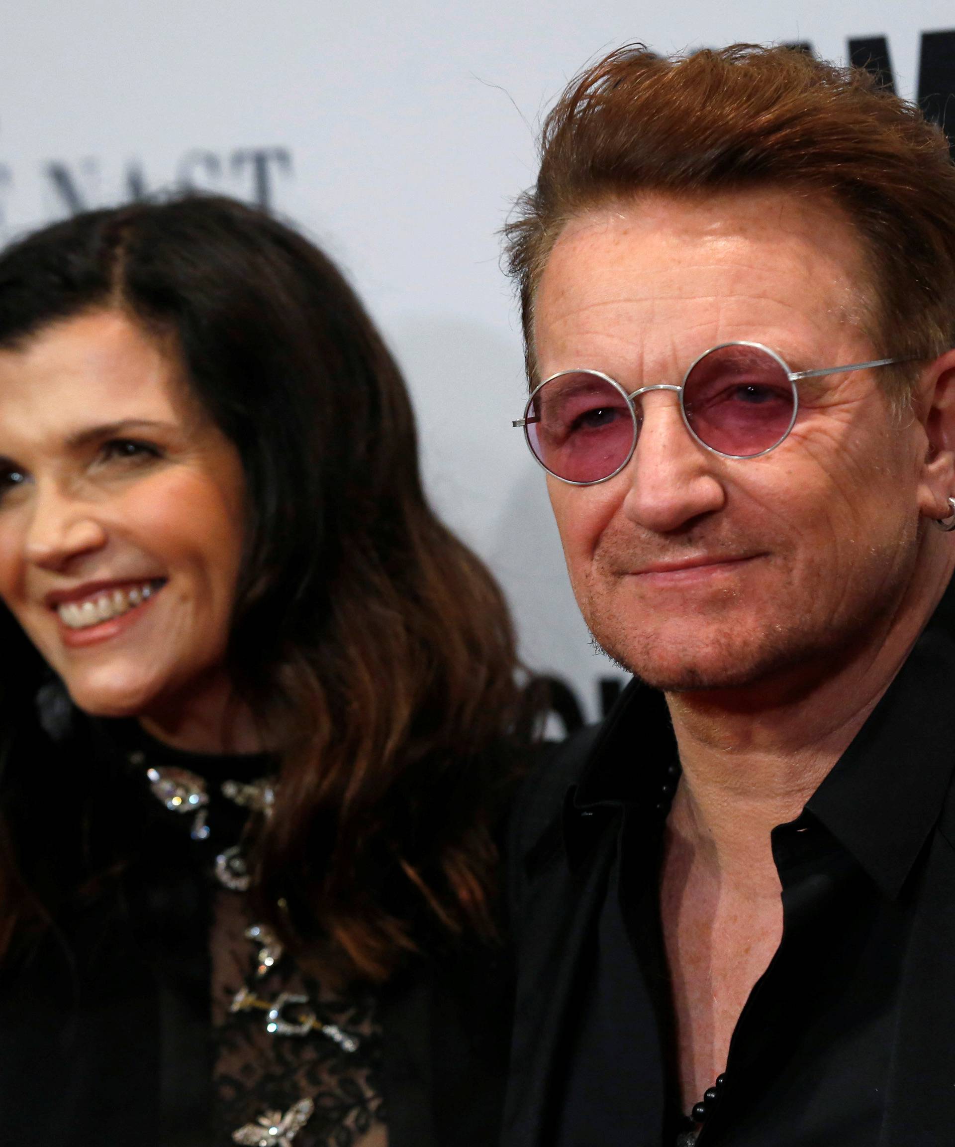 Recording artist and honoree Bono of U2 and his wife Ali Hewson pose at the Glamour Women of the Year Awards in Los Angeles