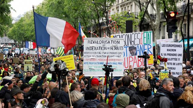 Protesters wearing yellow vests attend a demonstration in Paris