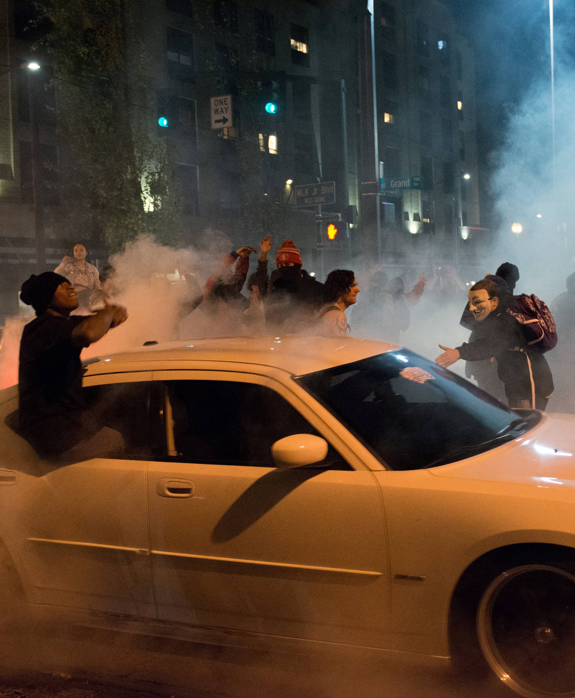 A demonstrator performs a burnout during a protest against the election of Republican Donald Trump as President of the United States in Portland