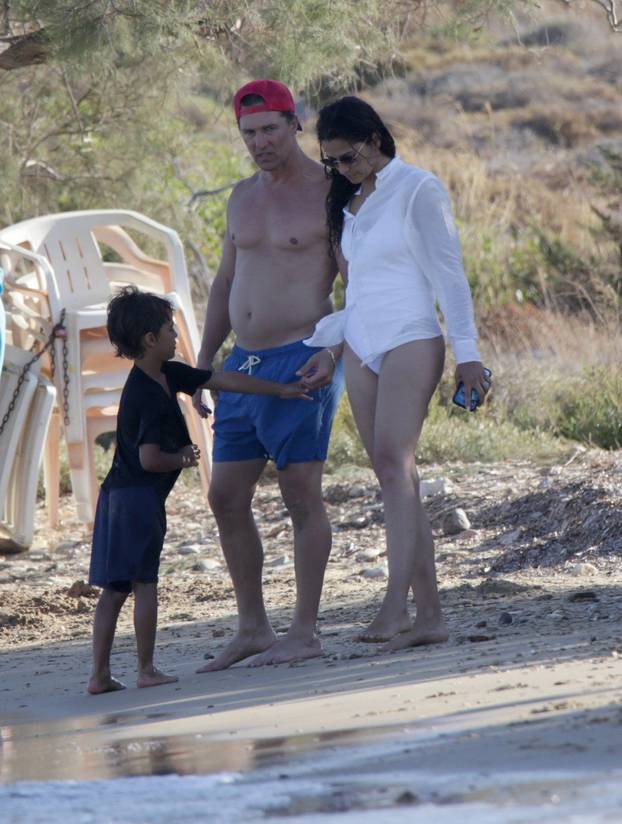 EXCLUSIVE: Matthew McConaughey skims stones on a family vacation in Antiparos, Greece.