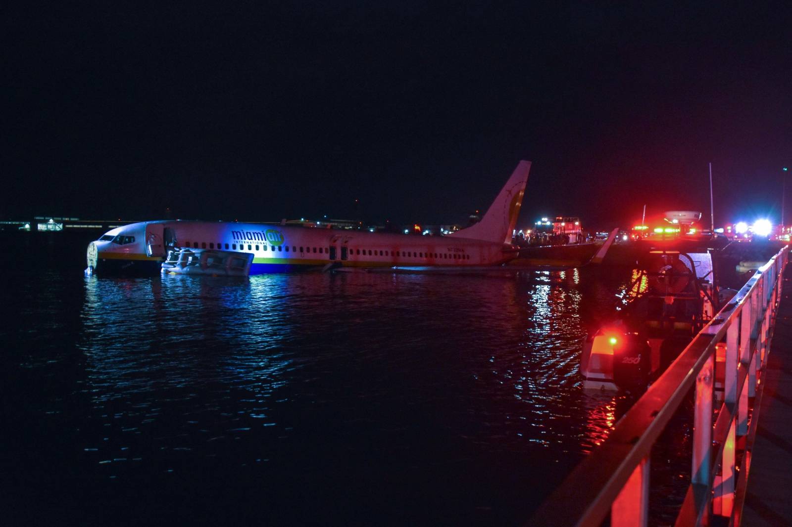 Boeing 737 aircraft sits in shallow water of the St Johns River after it slid off the runway at Naval Air Station Jacksonville, Florida