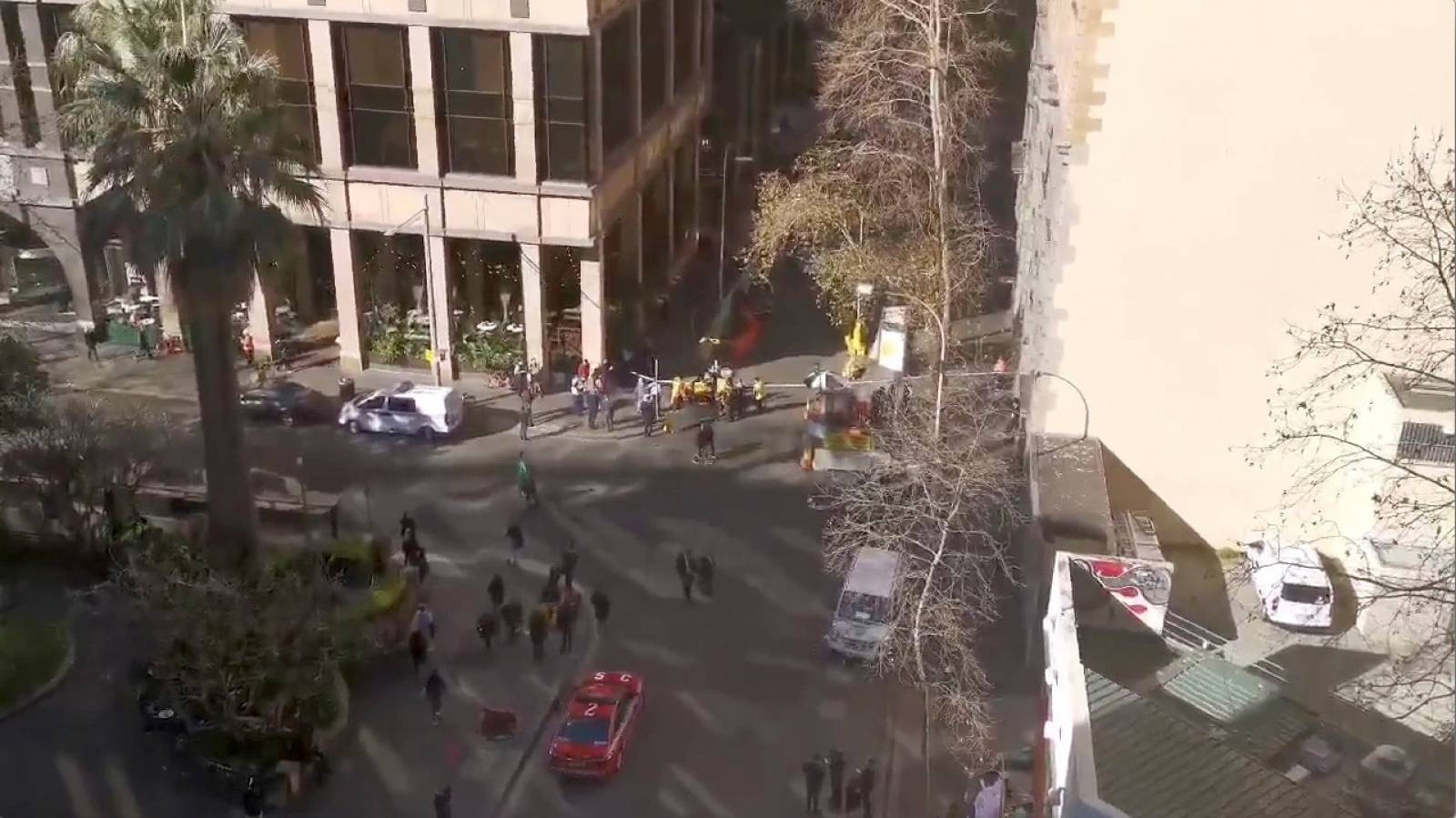 An aerial view shows security officers standing around a barricaded area in Sydney