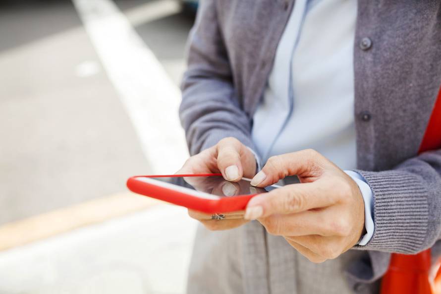 Close-up of woman using cell phone