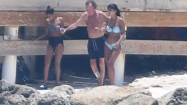 EXCLUSIVE: Julio Iglesias and two bikini-clad companions on the beach in front of his magnificent home in Punta Cana in the Dominican Republic